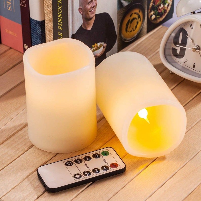 Pack of 12 Flameless Candles Real Wax Ivory LED Candles Φ3” x 4” Flickering Amber Flame Pillar Candles with Remote Control Timer